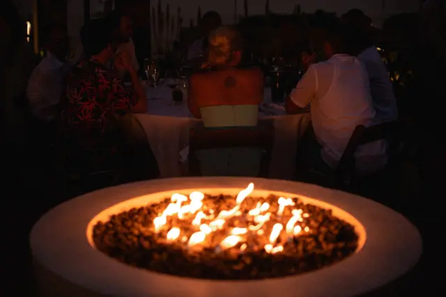 Concrete fire pit with flames
