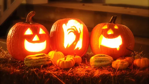 Carved pumpkins on hay