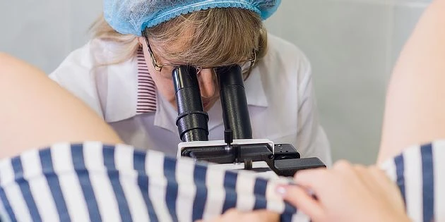 Gynecologist examining patient