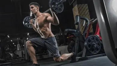 Man doing lunge with barbell