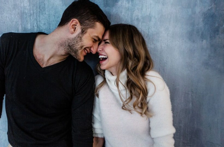 Happy couple laughing together