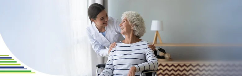 Nurse caring for elderly woman in wheelchair