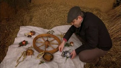 Man with spinning wheel and herbs