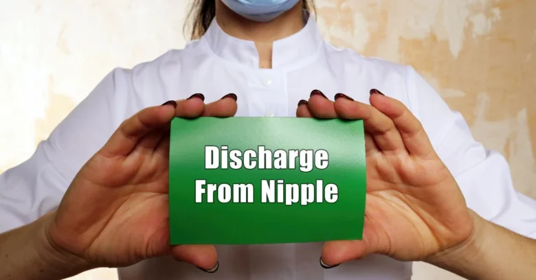 Discharge from nipple sign held by nurse