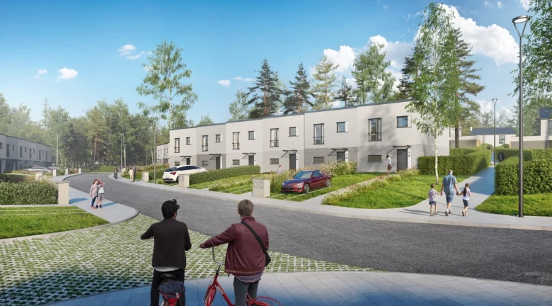 Moderní rezidenční komplex s domy uprostřed zeleně.