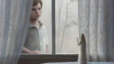 Boy looking at angel figure