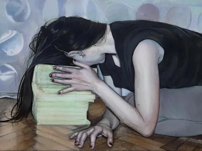 Woman resting on books